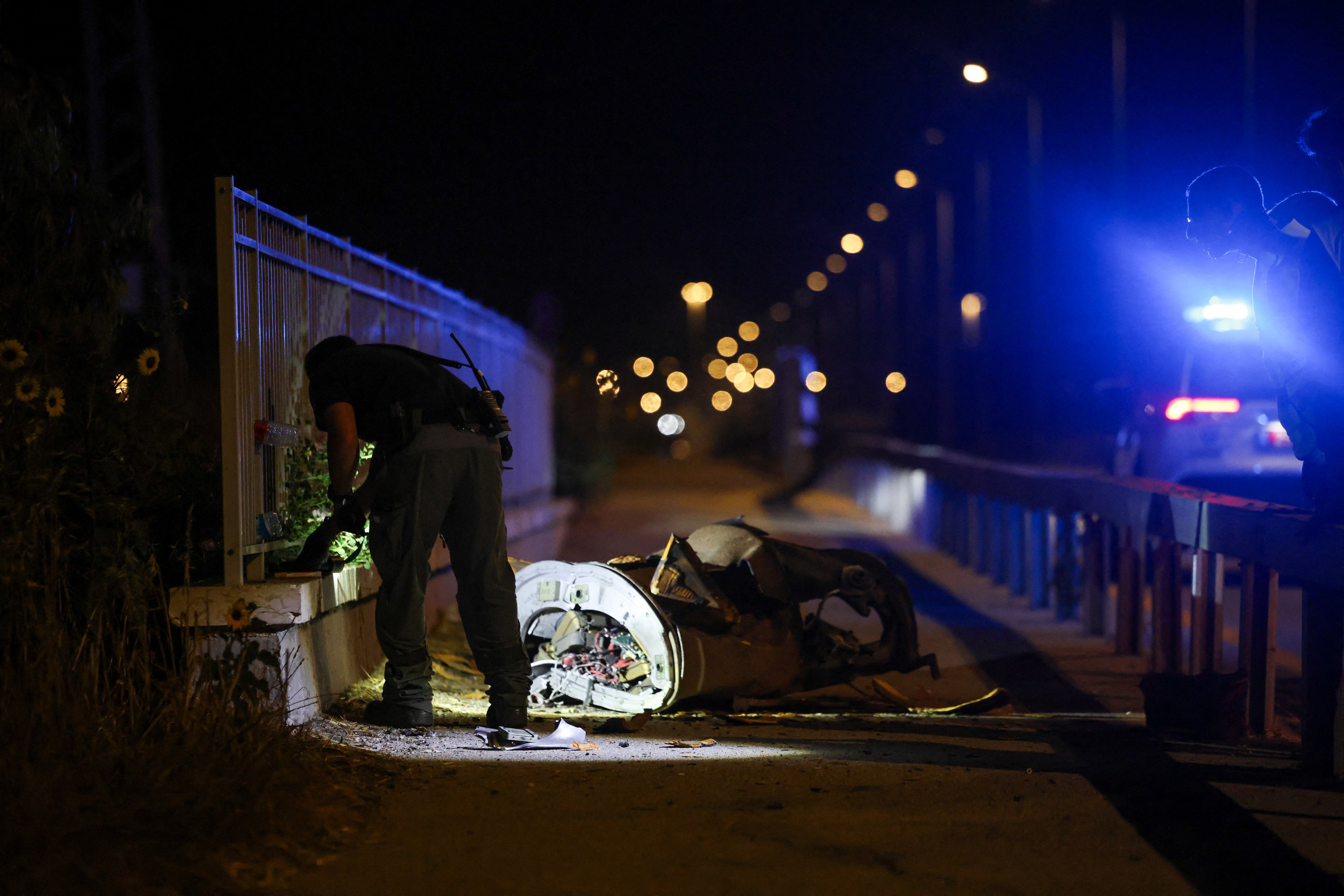 Israeli security and rescue personnel work next to a part of a projectile following a missile attack from Iran towards Israel in northern Israel, June 8, 2026. Israeli security and rescue personnel work next to a part of a projectile following a missile attack from Iran towards Israel in northern Israel, June 8, 2026.