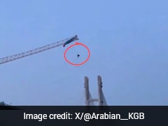 Paraglider Dangles 60 Metres In Air After Getting Stuck On Crane In China