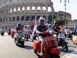 10,000 Vespas Swarm Rome's Historic Sites To Mark Scooter's 80th Anniversary