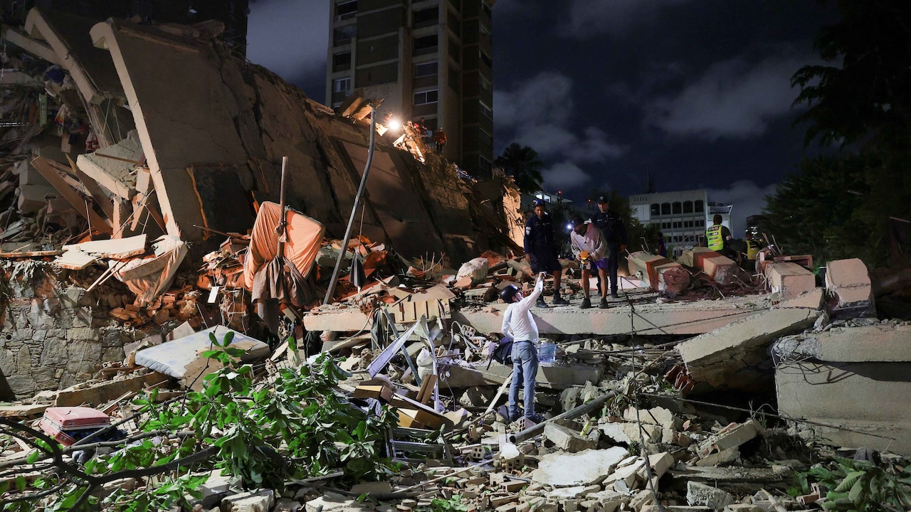 Emergency services work at the site of a collapsed building after an earthquake, in Caracas, Venezuela