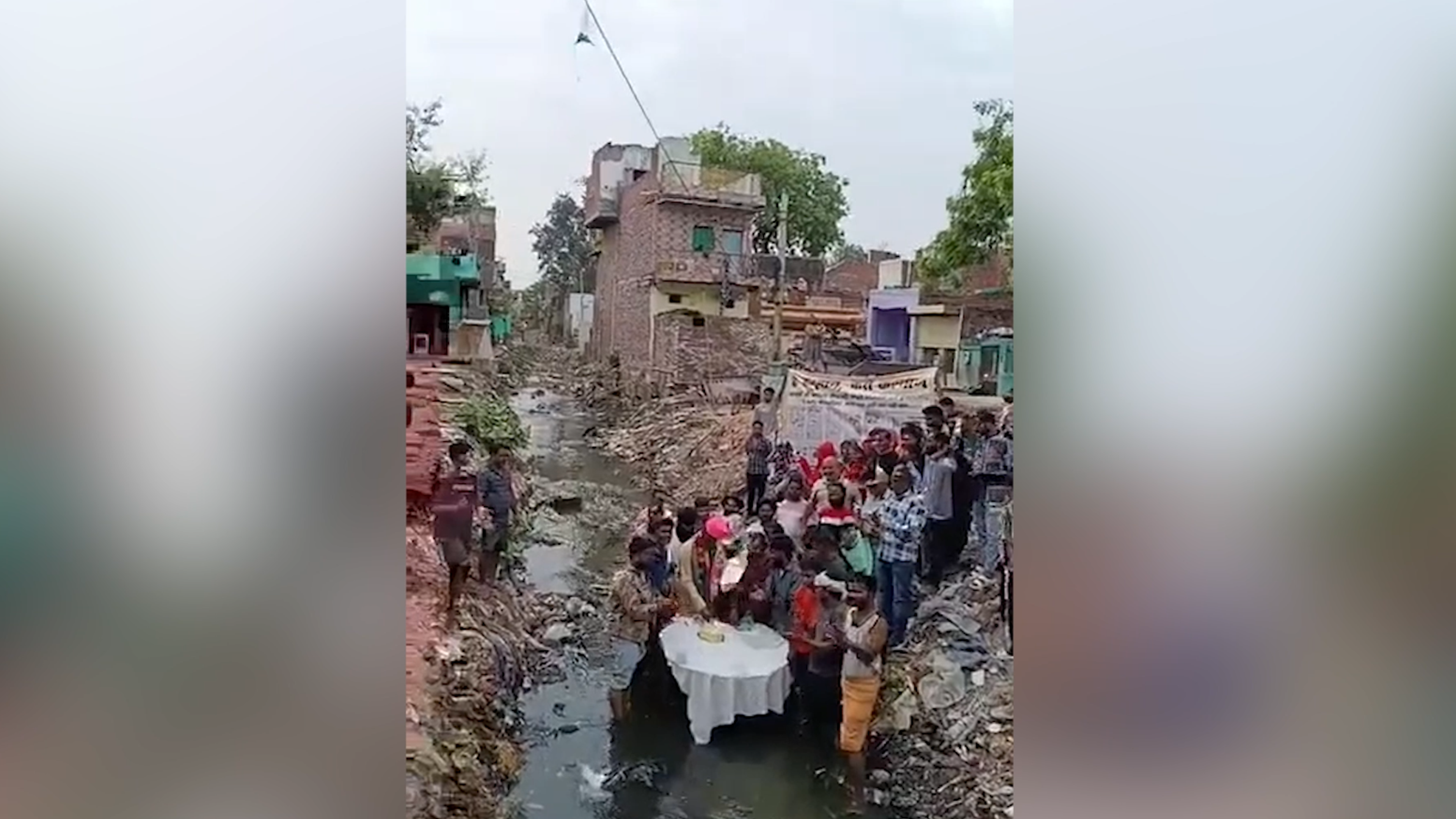 BJP Councillor In Agra Cuts Birthday Cake Standing In A Drain
