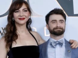 Daniel Radcliffe And Erin Darke Pose Together On The Red Carpet At The 79th Tony Awards