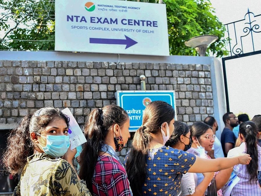 Mother Pleads Security Guards to Let Daughter Enter NEET UG Re-Exam Centre