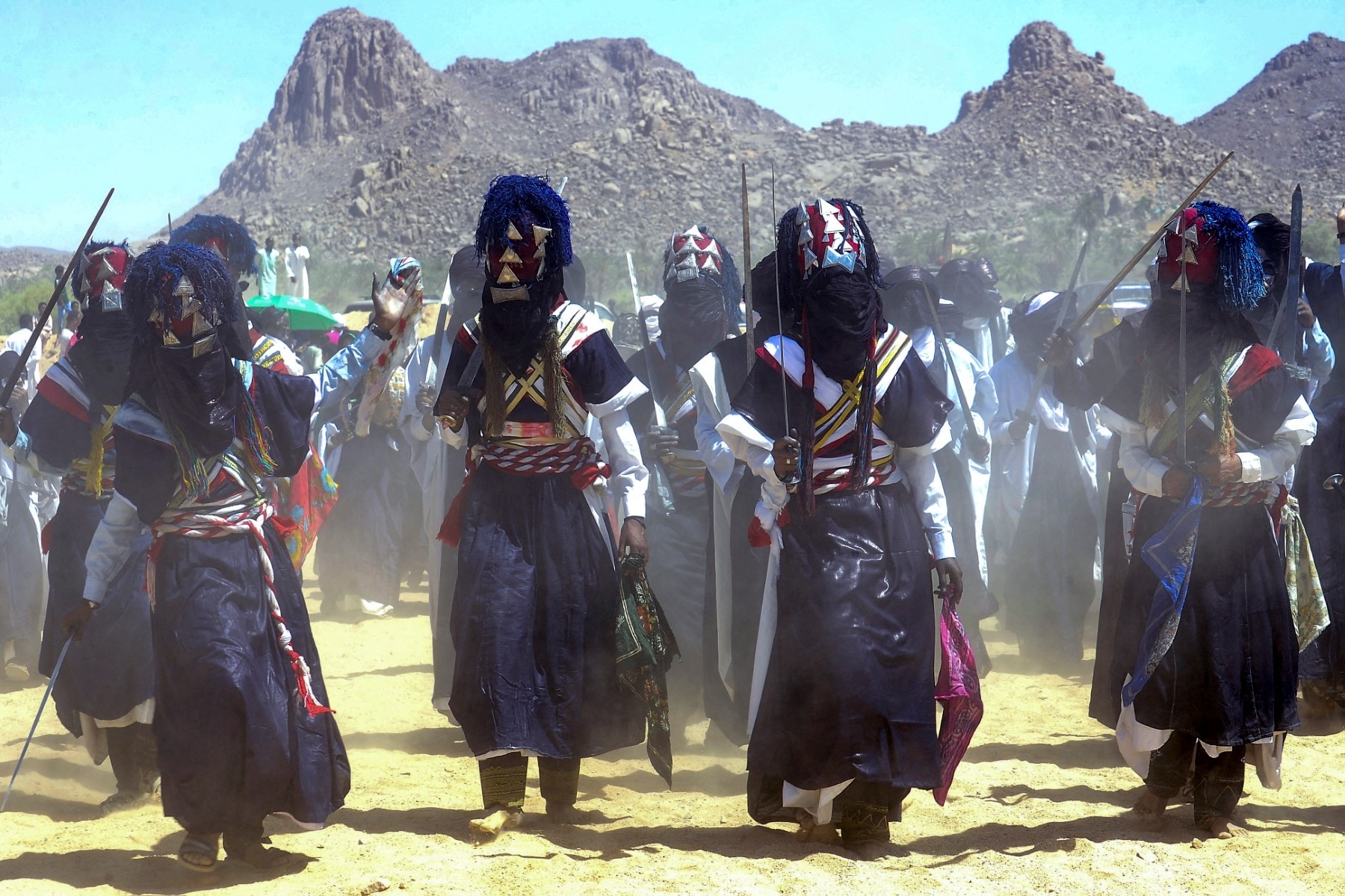 Men perform a traditional dance during the Sebeiba Festival, a yearly celebration of Tuareg culture, in the oasis town of Djanet in southeastern Algeria.