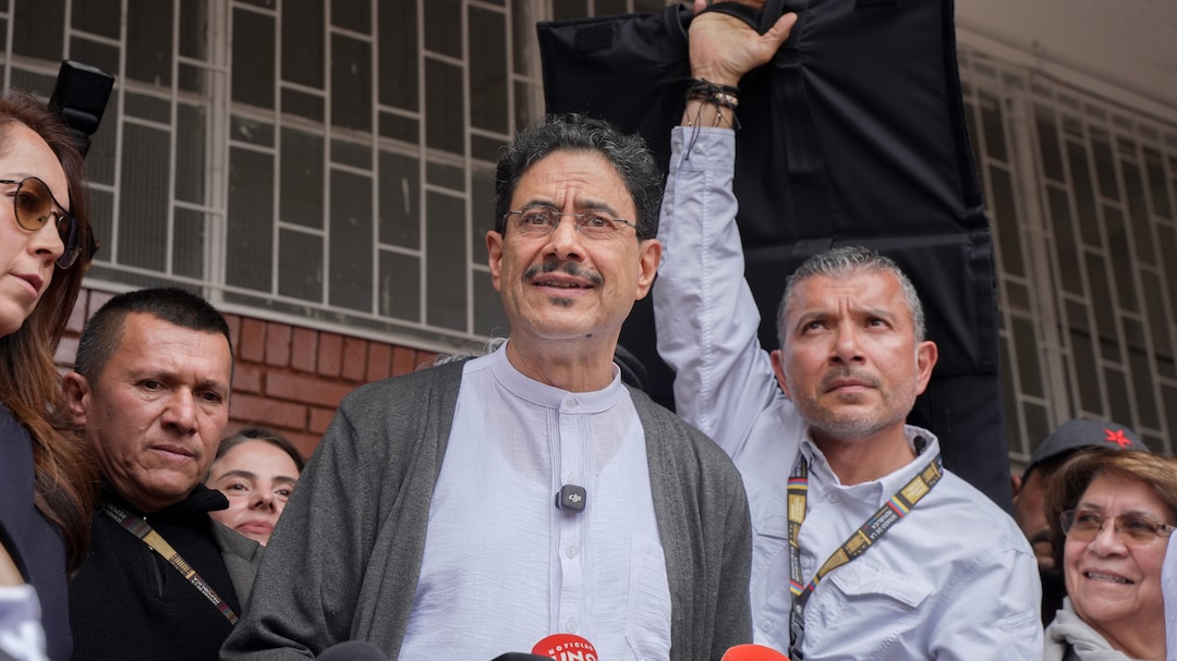 Voters wait in line outside a polling station in Bogota on May 31. 
