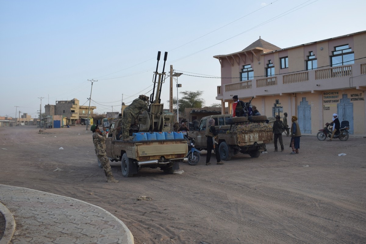 Tuareg rebels of the Azawad Liberation Front (FLA) ride on the back of pickup trucks in Kidal.