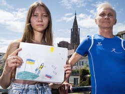 From Anti-War Sketch To Exile: Russian Father And Daughter Defy Putin
