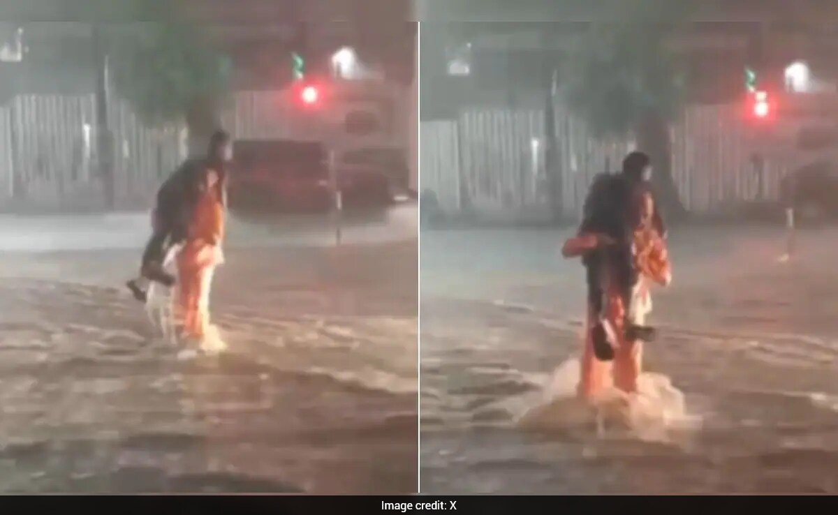 Bengaluru Traffic Officer Carries Differently-Abled Man To Safety Through Flooded Street