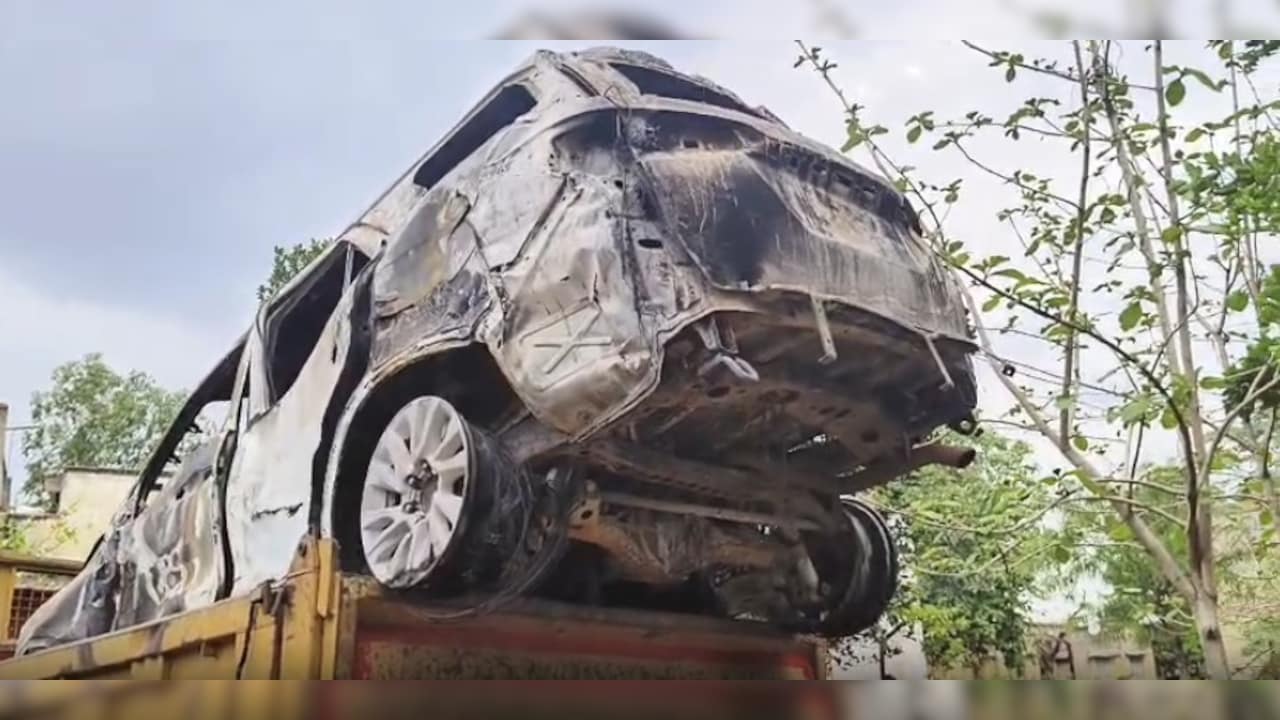 Burnt remains of the victims car Burnt remains of the victims car
