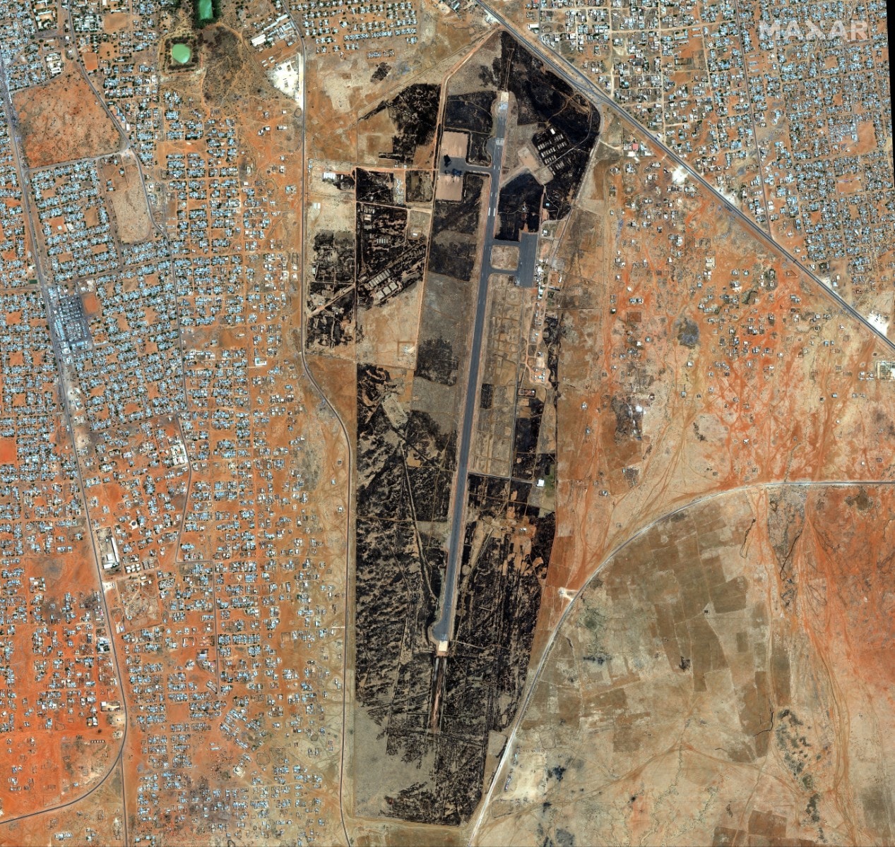 This handout satellite image courtesy of Maxar Technologies taken on April 18, 2023 shows an overview of El-Obeid airbase in Sudan. A weeks-long power struggle erupted into deadly violence on April 15 between the forces of two generals who seized power in a 2021 coup. (Photo by Satellite image ©2023 Maxar Technologies / AFP)
