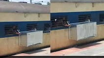Passenger Holds Metal Trunk Out Of Moving Train Window, Railways Reacts
