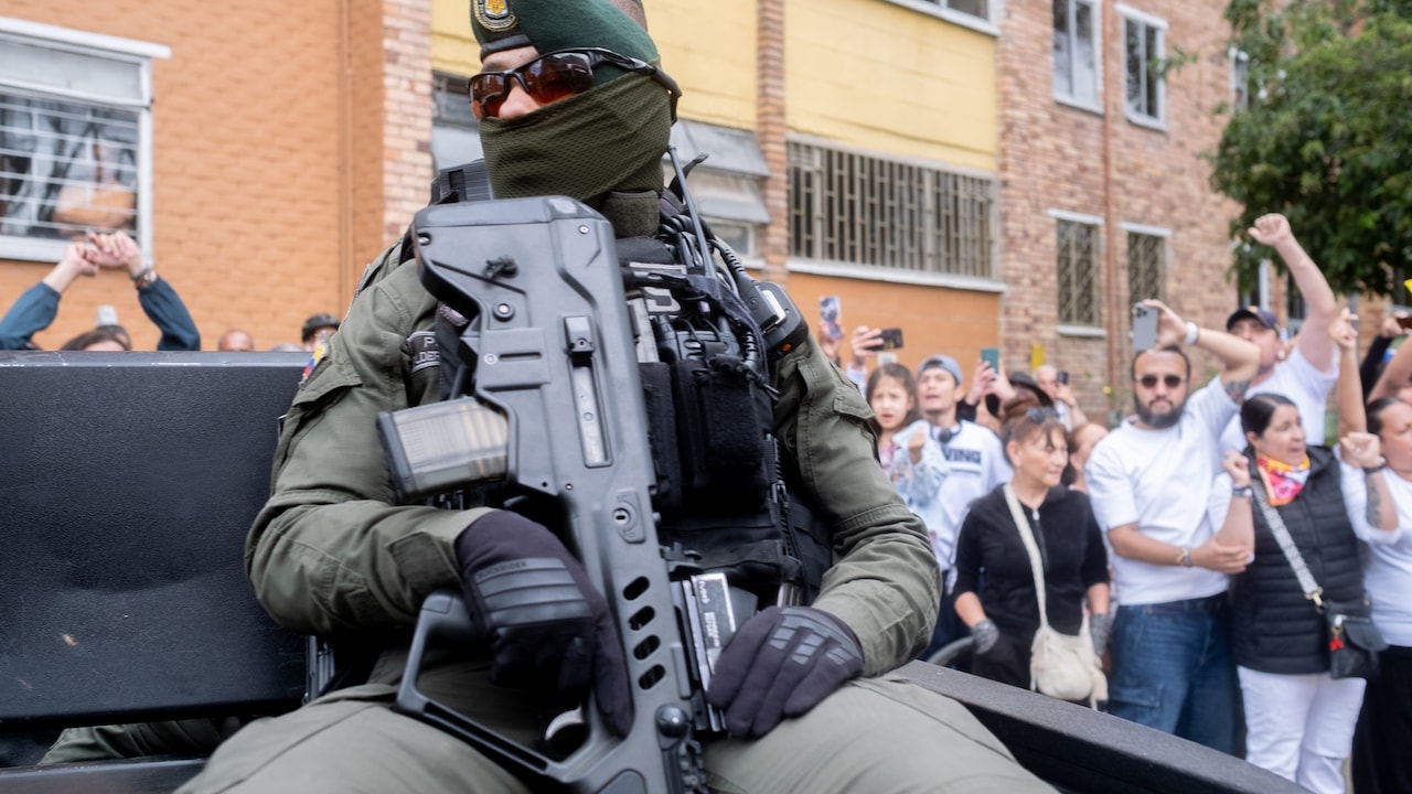 A member of the military stands guard outside a polling station during the runoff presidential election in Bogota on June 21. Photographer: Santiago Mesa/Bloomberg A member of the military stands guard outside a polling station during the runoff presidential election in Bogota on June 21. Photographer: Santiago Mesa/Bloomberg