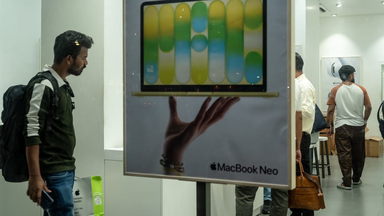An advertisement for Apple Inc.'s MacBook Neo displayed inside a Unicorn store, an Apple reseller, in Mumbai, India.