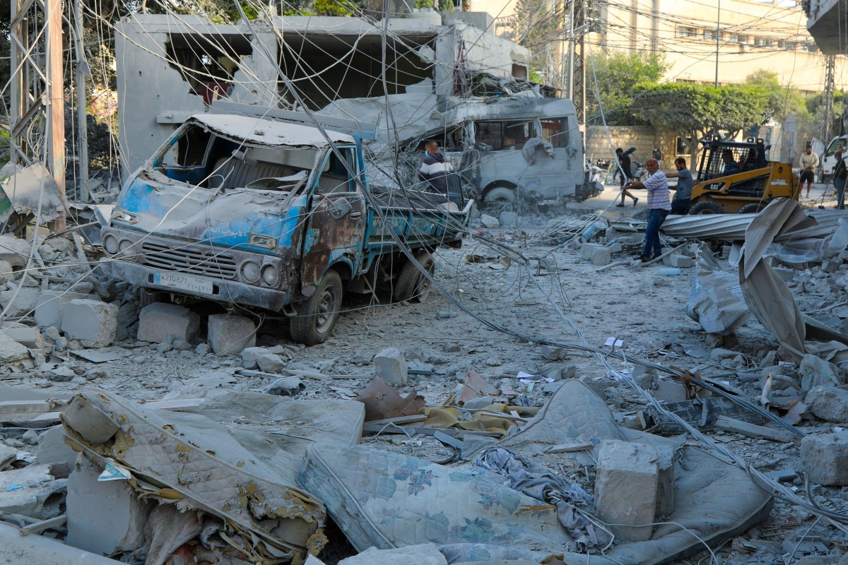 Workers clean debris a day after Israeli airstrikes in Tyre on June 8, 2026. Workers clean debris a day after Israeli airstrikes in Tyre on June 8, 2026.