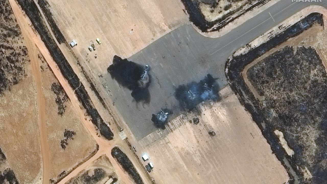 This handout satellite image courtesy of Maxar Technologies taken on April 18, 2023 shows a close-up view of destroyed Su-25 ground attack aircraft, at El-Obeid airbase in Sudan. A weeks-long power struggle erupted into deadly violence on April 15 between the forces of two generals who seized power in a 2021 coup. (Photo by Satellite image ©2023 Maxar Technologies / AFP) 