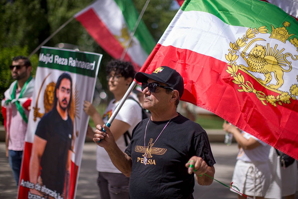Iran football fans display pre-1979 flag despite FIFA restrictions