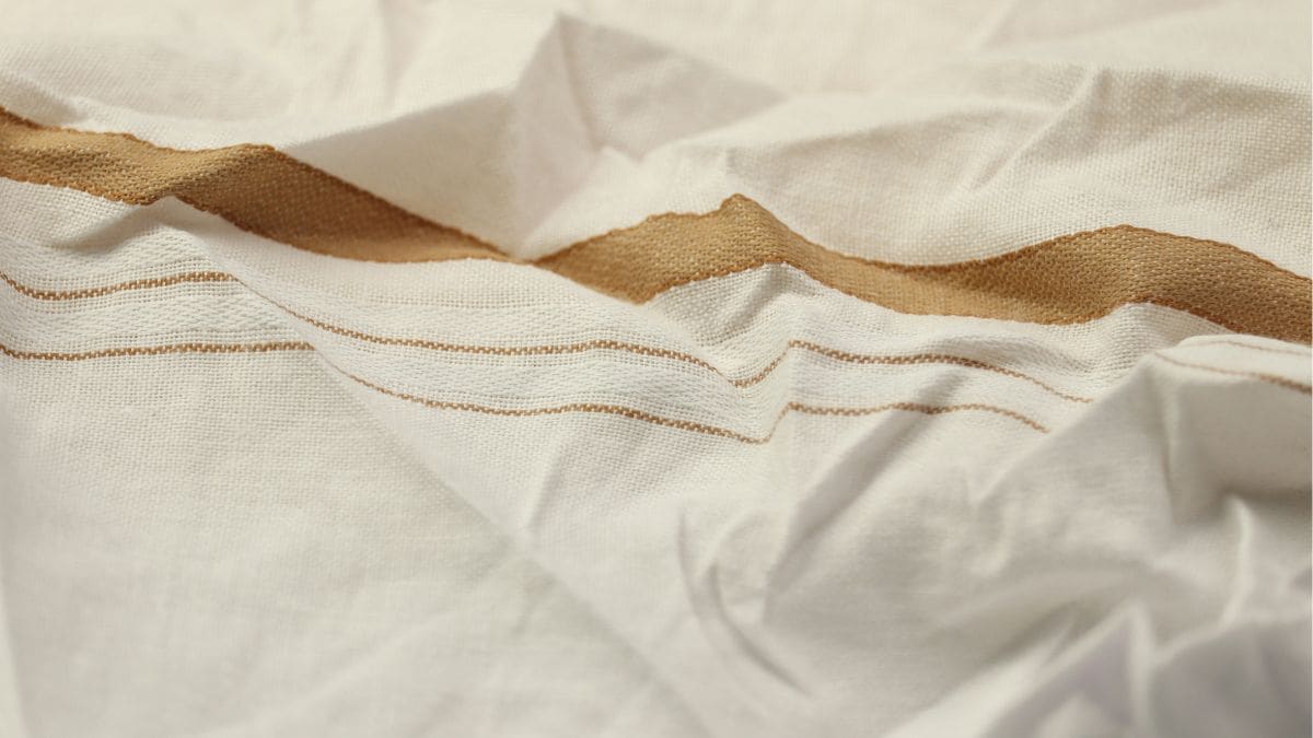A gamcha simultaneously functions as a head cover, cooling cloth, towel, and protective accessory. Photo: Unsplas A gamcha simultaneously functions as a head cover, cooling cloth, towel, and protective accessory. Photo: Unsplas
