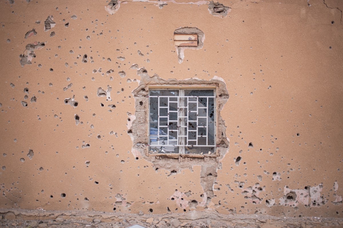 A general view of a wall covered in bullet holes at a school near the Kidal regional headquarters in Kidal.