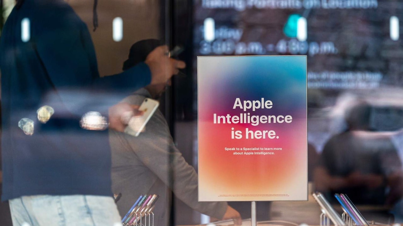 Signage for Apple Intelligence inside an Apple retail store. Signage for Apple Intelligence inside an Apple retail store.