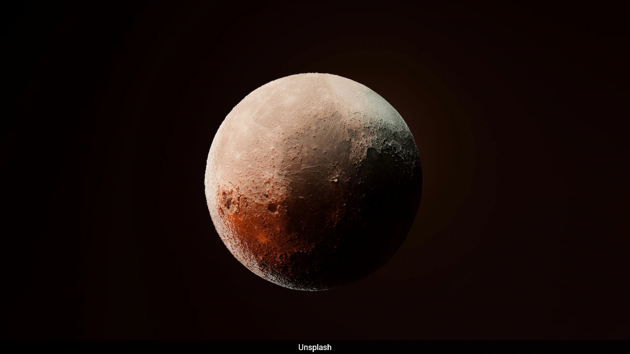 Scientists Find Strange Chemical Signature On Pluto And Titan That No One Can Identify