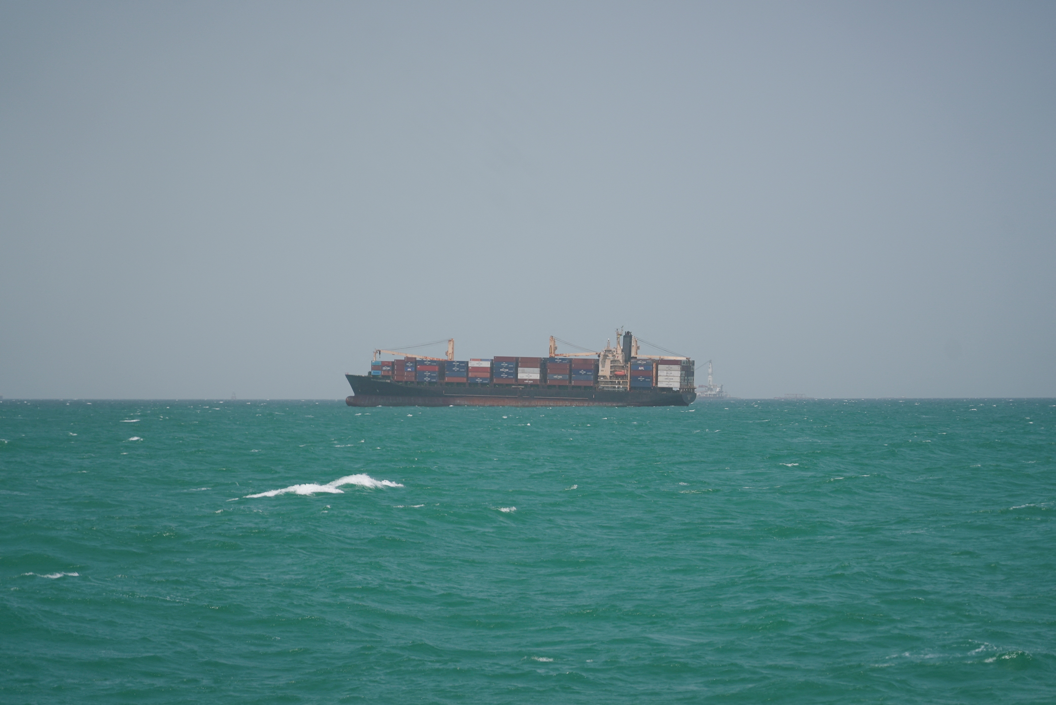 FILE PHOTO: A cargo ship sails in Saudi waters near the Dammam Port in Dammam, Saudi Arabia, May 17, 2026. REUTERS/Mohammed Benmansour/File Photo