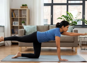 6 Simple Pilates Exercises You Can Do At Home Without Any Equipment