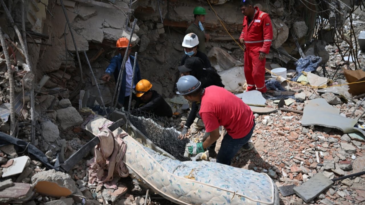 Rescue workers search through the rubble of a collapsed building in La Guaira, Venezuela, following the devastating June 24 earthquake Rescue workers search through the rubble of a collapsed building in La Guaira, Venezuela, following the devastating June 24 earthquake