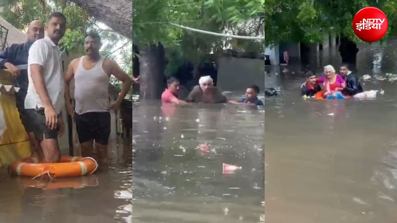 गुजरात में मूसलाधार बारिश से भारी तबाही, राहत दल ने साबरमती में बाढ़ के बीच फंसे 11 लोगों को बचाया