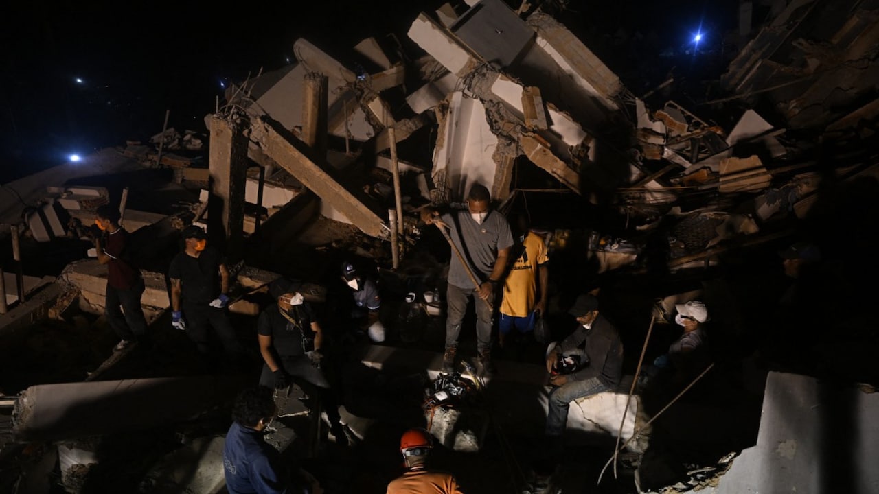 Rescue workers rest amid collapsed building rubble in Venezuela, as officials warn of rising disease risk Rescue workers rest amid collapsed building rubble in Venezuela, as officials warn of rising disease risk