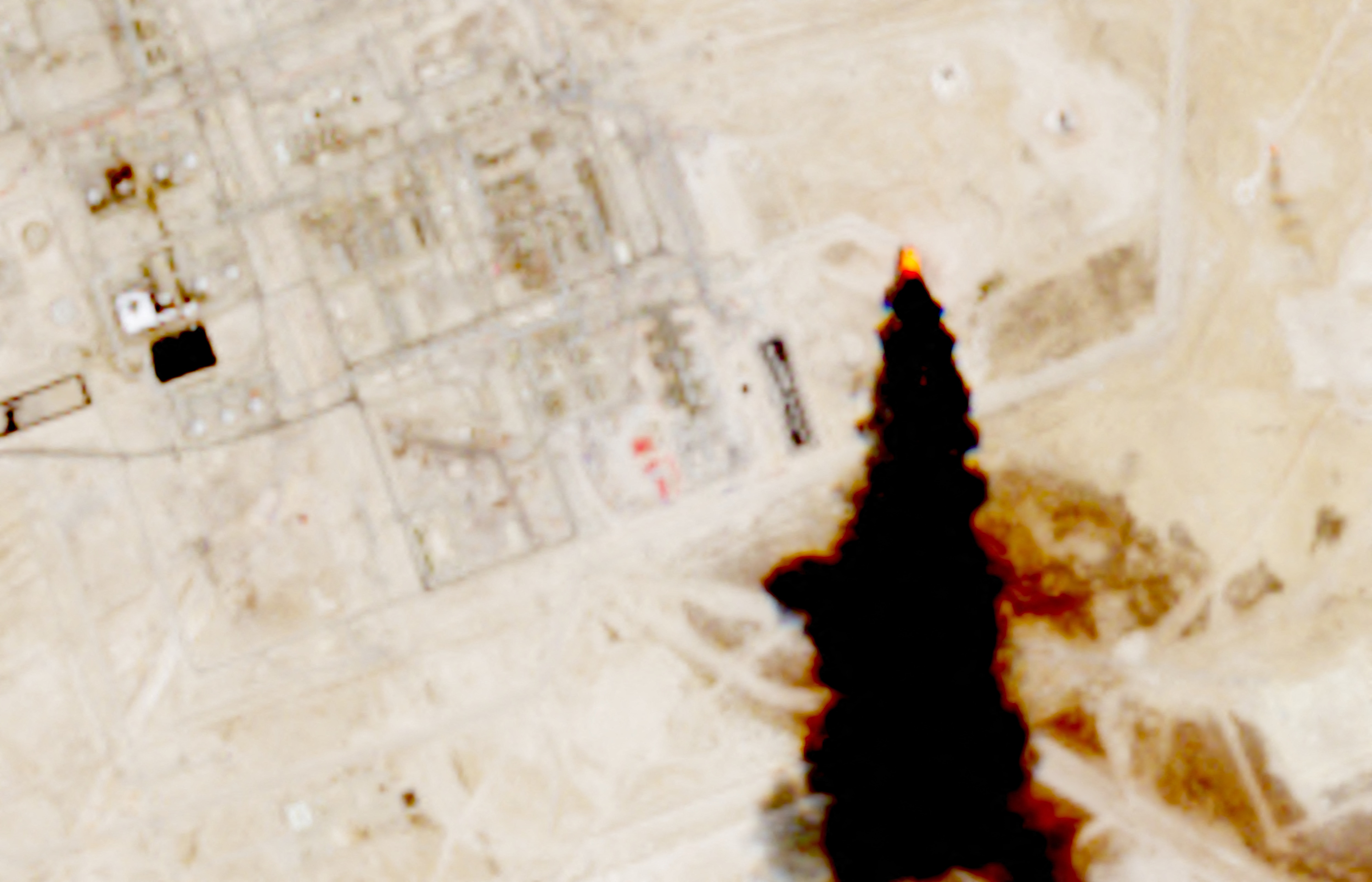 A satellite image shows smoke coming out of an oil facility, as Yemens Iran-aligned Houthis said on Monday they targeted a number of sensitive crude oil supply and transport sites, according to a statement by the groups military spokesperson Yahya Sare, in Abqaiq, Saudi Arabia July 27, 2026. Courtesy European Union/Copernicus Sentinel-2/Handout via REUTERS