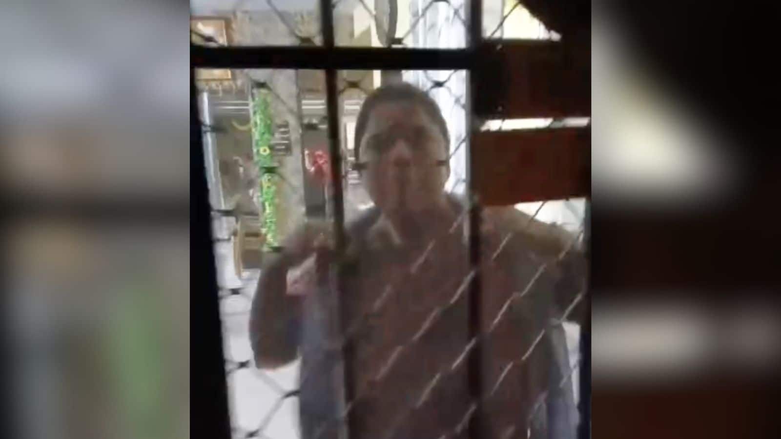 The woman threatens to tear off her clothes when confronted by the house owner