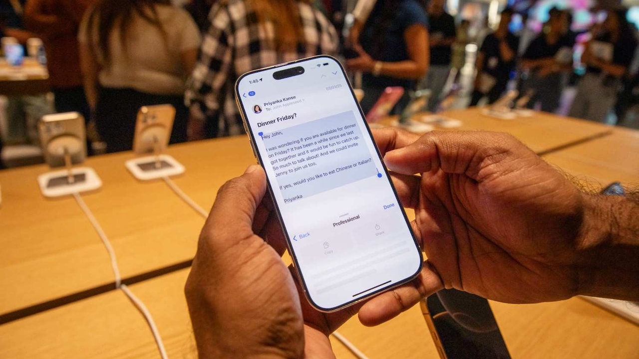 A customer tries the Apple Intelligence function on an iPhone. A customer tries the Apple Intelligence function on an iPhone.
