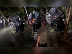 VIDEO: कुछ घंटों की बारिश में तालाब बनीं इंदौर की सड़कें, बह गई थार, क्रेन से बाहर निकाला