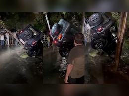VIDEO: कुछ घंटों की बारिश में तालाब बनीं इंदौर की सड़कें, बह गई थार, क्रेन से बाहर निकाला