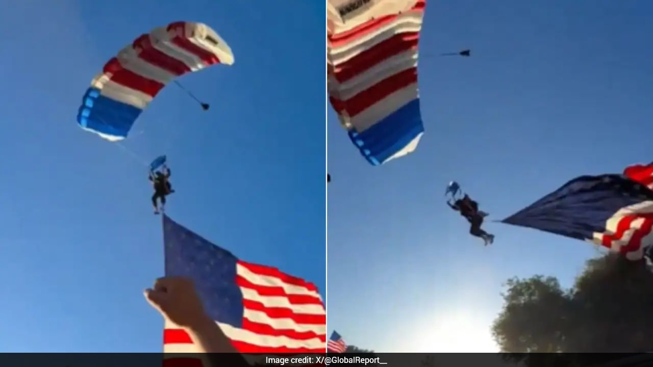 Skydiver Carrying US Flag Crashes Into Tent After Mid-Air Landing Incident