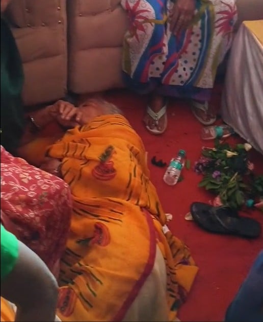 A woman faints and is down on the ground amid scramble for gifts at Rakhi event in UP 