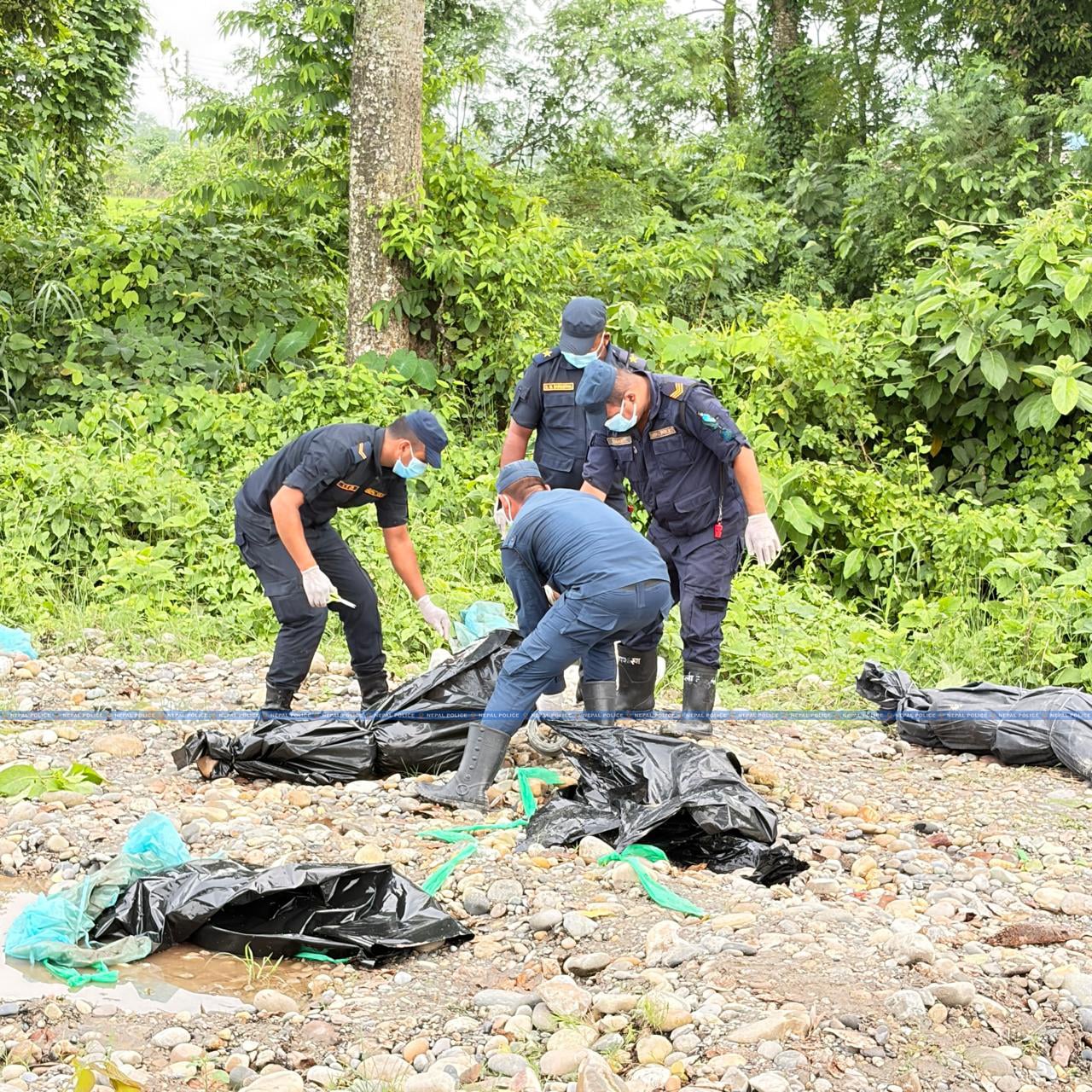 Nepal begins temporary burial of unidentified flood victims with DNA for later identification