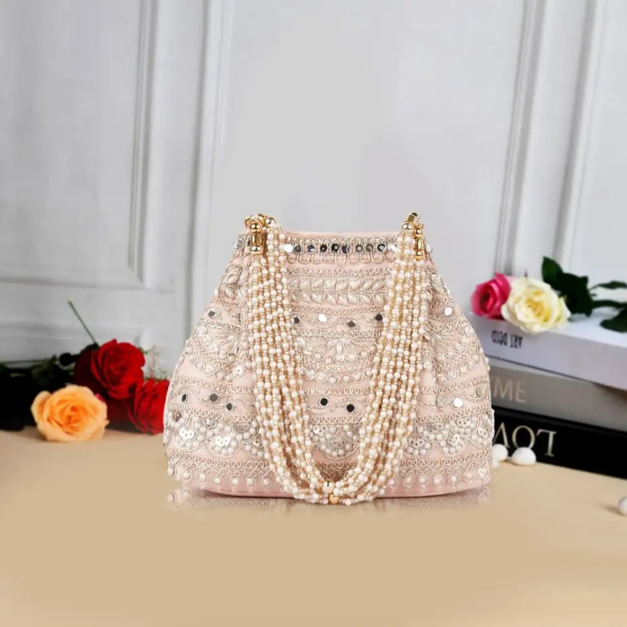 Click here to buy: PLANX Classy Fancy Embroidery Traditional Design Potli Bag Click here to buy: PLANX Classy Fancy Embroidery Traditional Design Potli Bag