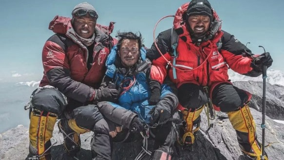 Nirmal Nims Purjas first 8,000-metre summit, Dhaulagiri. Nims is in the middle, with Dawa Sherpa (left) and Krish Thapa (right).