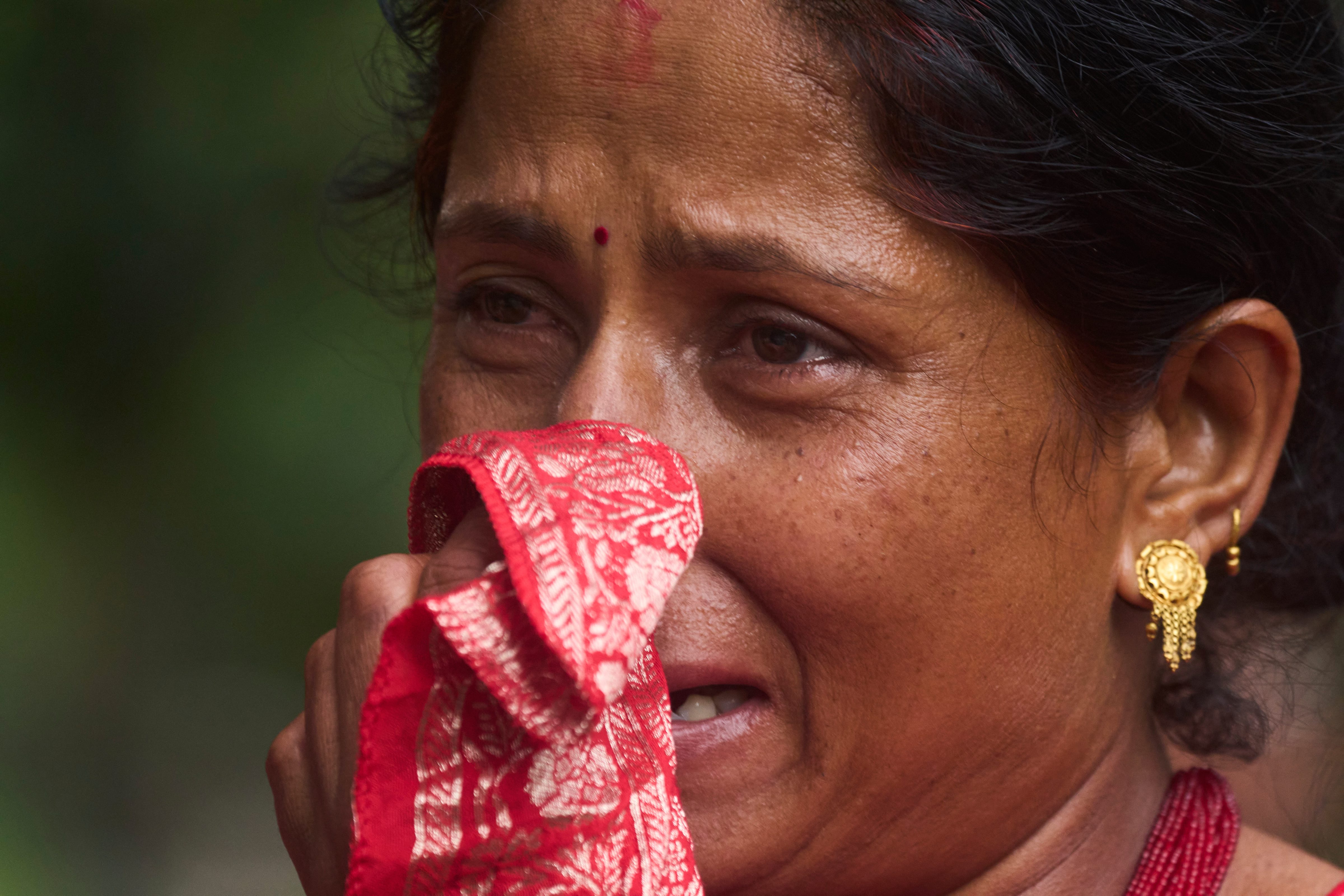 A woman cries as she searches for relatives missing after flash floods in the Trishuli river in Nepals Nuwakot district on Wednesday, August 26, 2026. A woman cries as she searches for relatives missing after flash floods in the Trishuli river in Nepals Nuwakot district on Wednesday, August 26, 2026.