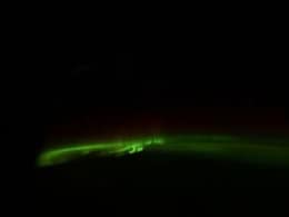 Astronaut Shares Auroras Glowing Outside Spacecraft Window, Calls It "Room With A View"