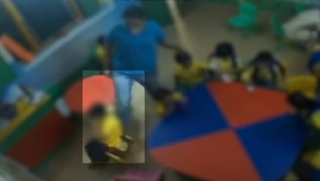 CCTV video shows the teacher pushing the childs chair across the floor with her leg CCTV video shows the teacher pushing the childs chair across the floor with her leg