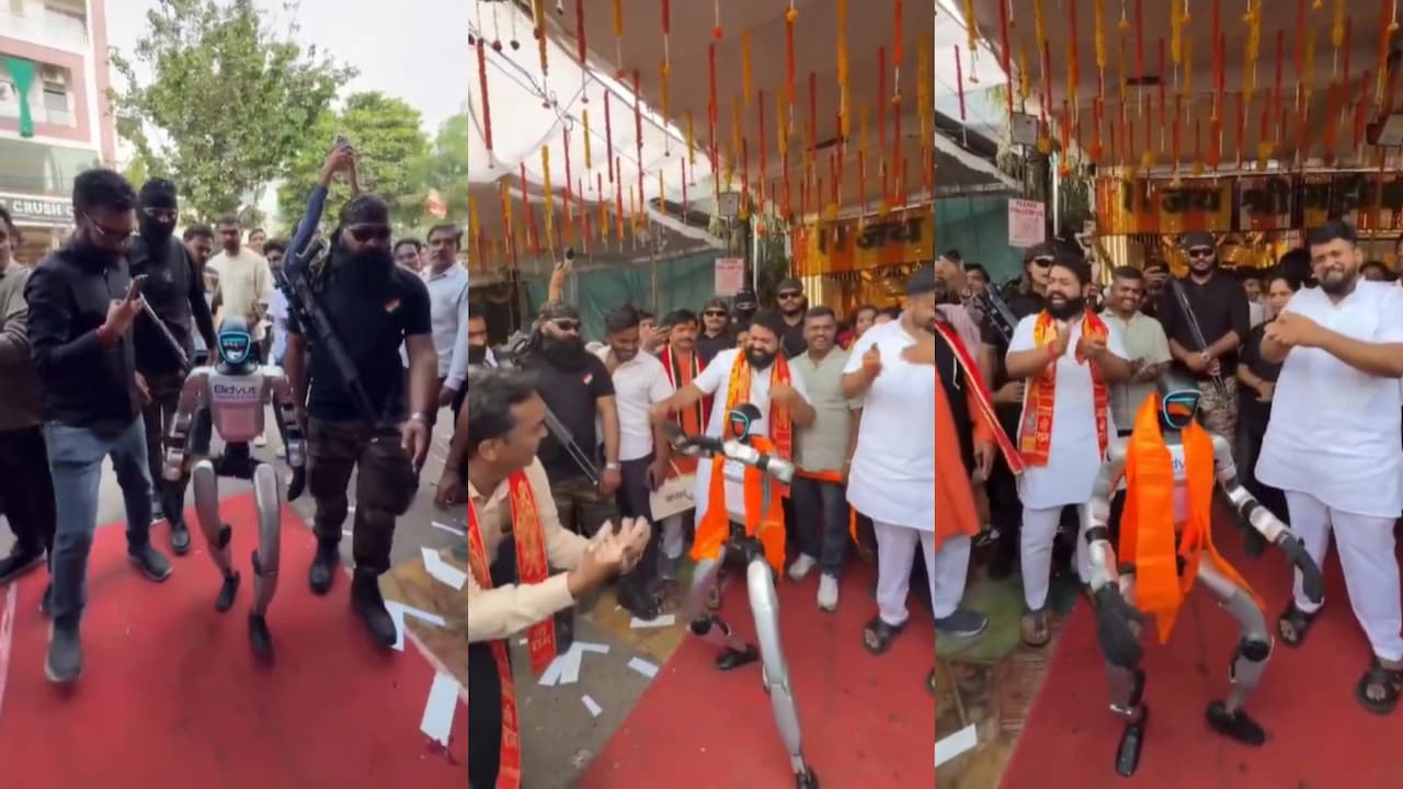 Video: कमांडो की सुरक्षा में रोबोट की एंट्री, उज्‍जैन में सैंडविच शॉप की ओपनिंग में किया डांस, देखते रह गए लोग