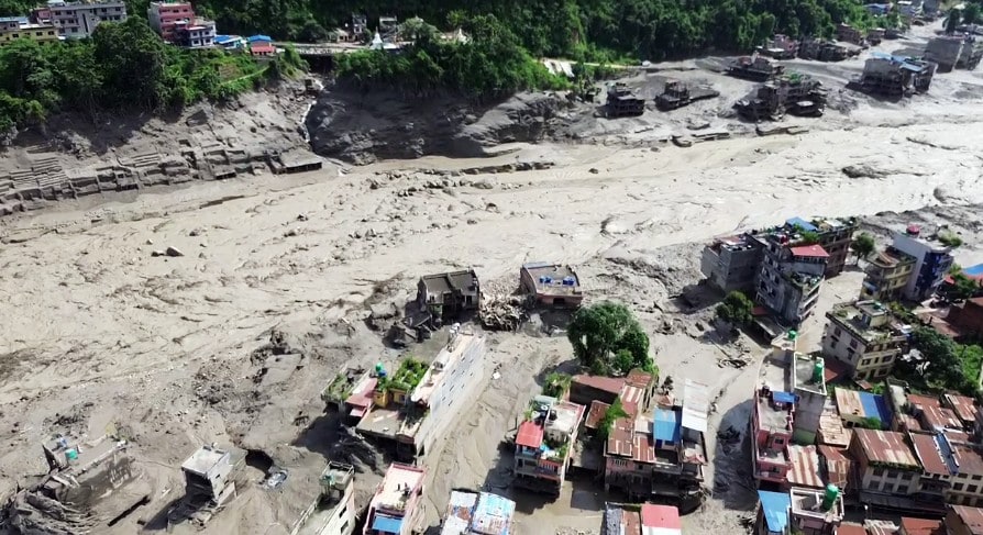 An aerial view of the houses partially submerged in mud-laden flash flood following an outburst in the Bhotekoshi River, in Nepals Rasuwa on Wednesday