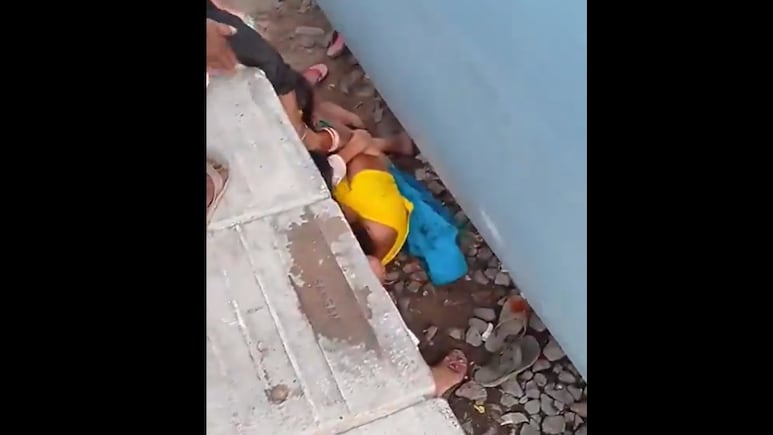 Horrifying Video Shows Mother Shielding Kids As Train Passes Inches Away