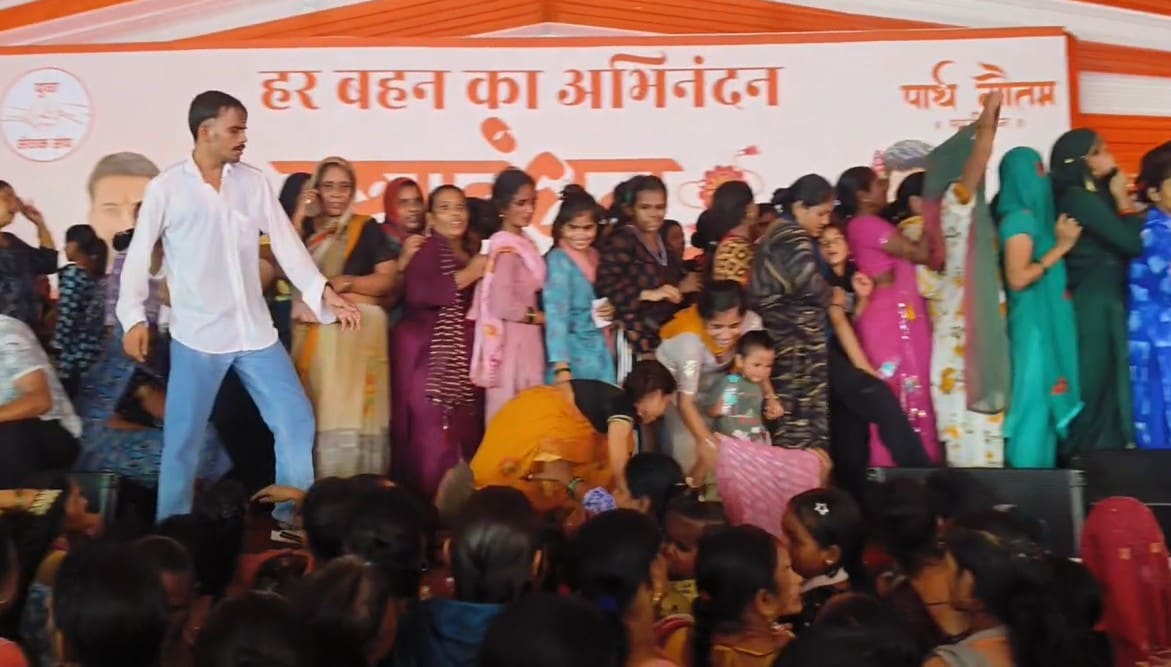 Women seen crowding the stage at a Rakhi event in UP