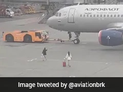 Two Women Chase Departing Plane Across Moscow Airport Tarmac After Missing Flight