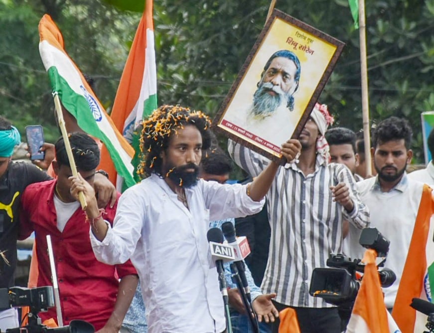 Devendra Nath Mahto carrying a picture of Shibu Soren Devendra Nath Mahto carrying a picture of Shibu Soren