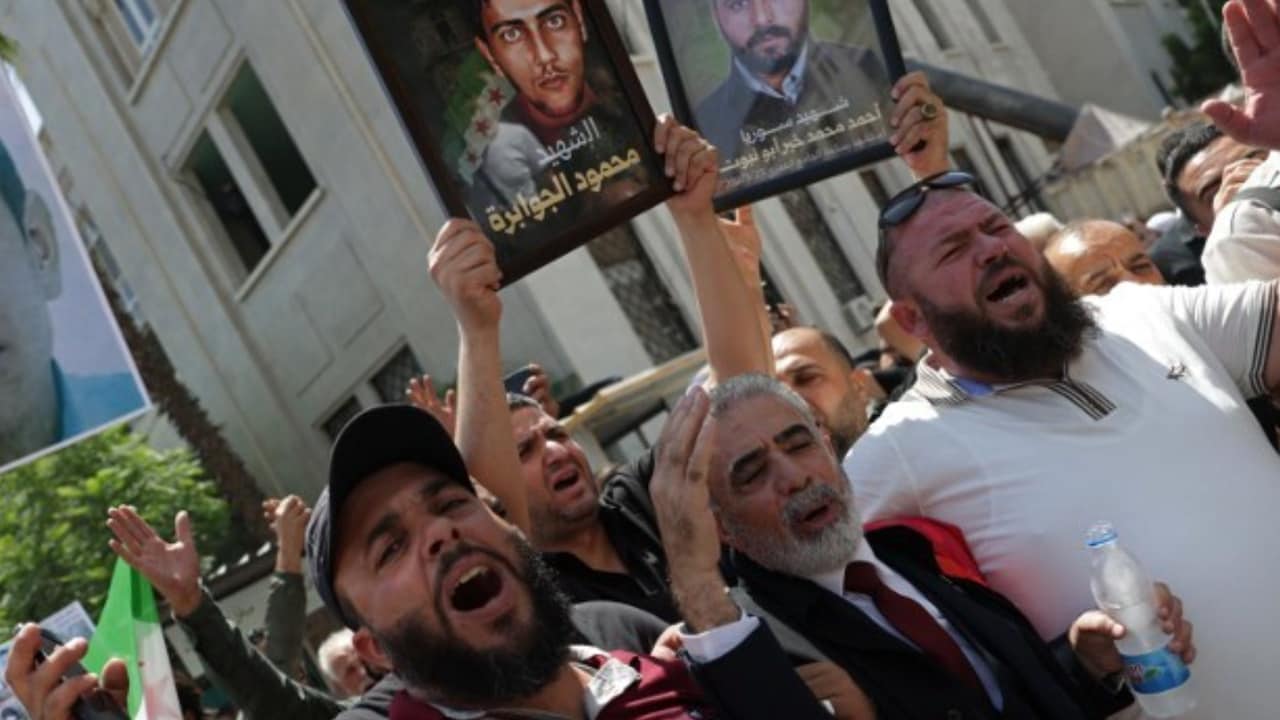 People celebrate after Bashar al-Assad sentenced to death AFP