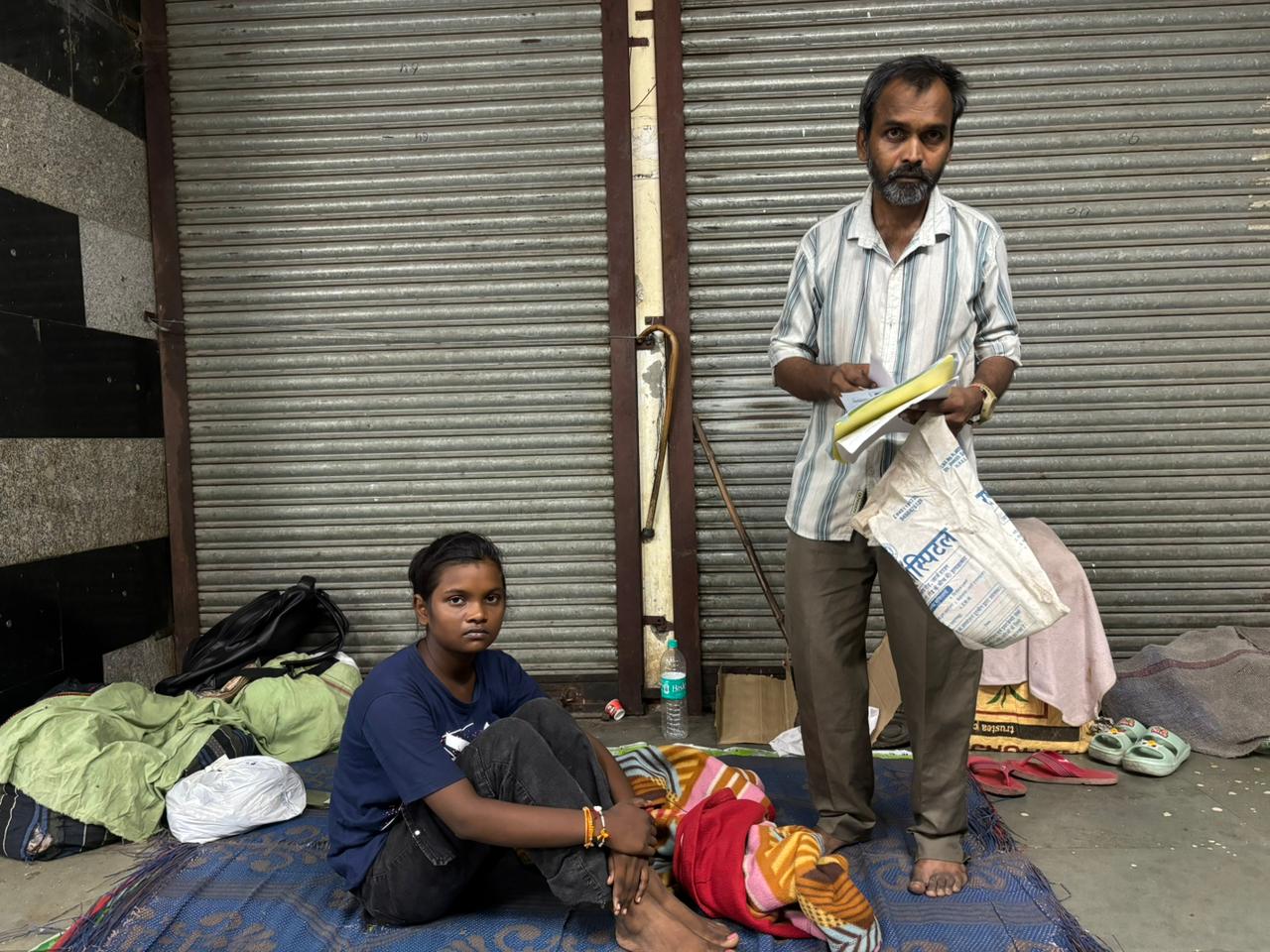 Anamika Patel and her father Sunil Patel sleep in an underpass.